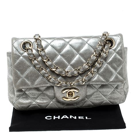 chanel silver flap bag.